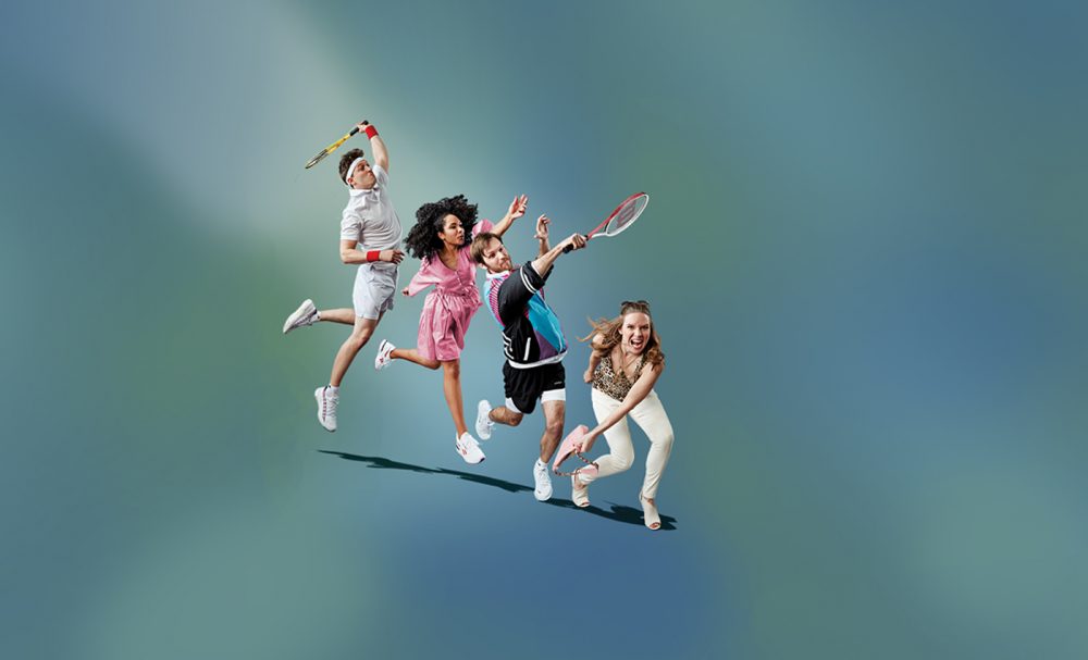 Four people swing tennis racquets.